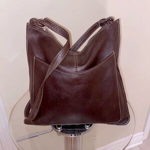 Genuine leather  unbranded bag w/silver tone zipper pull, knotted straps. 🤎